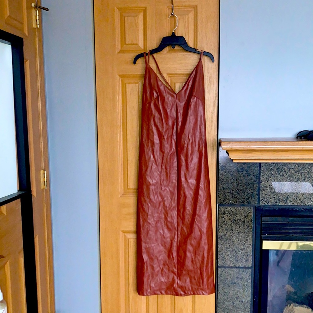 Designer gently used leather dress. Size Large.